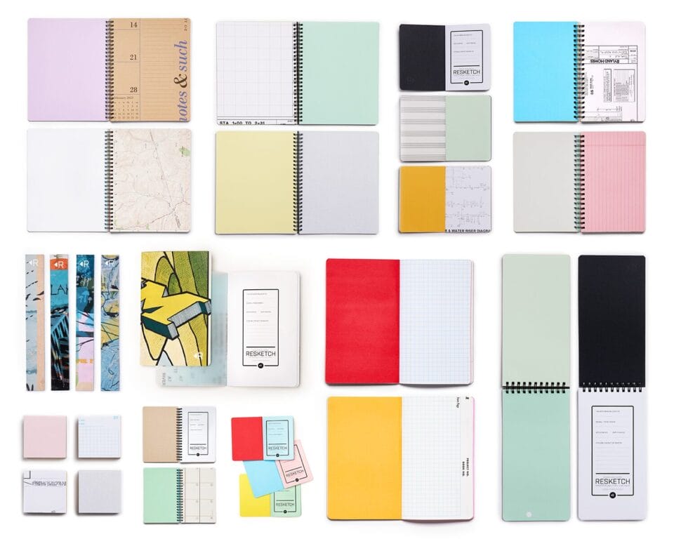 a collection of printed paper notepads