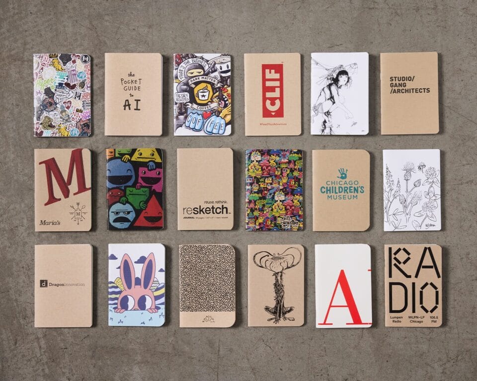 a collection of printed paper notepads