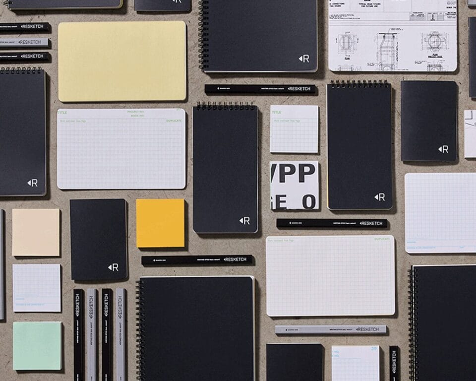 a collection of printed paper notepads