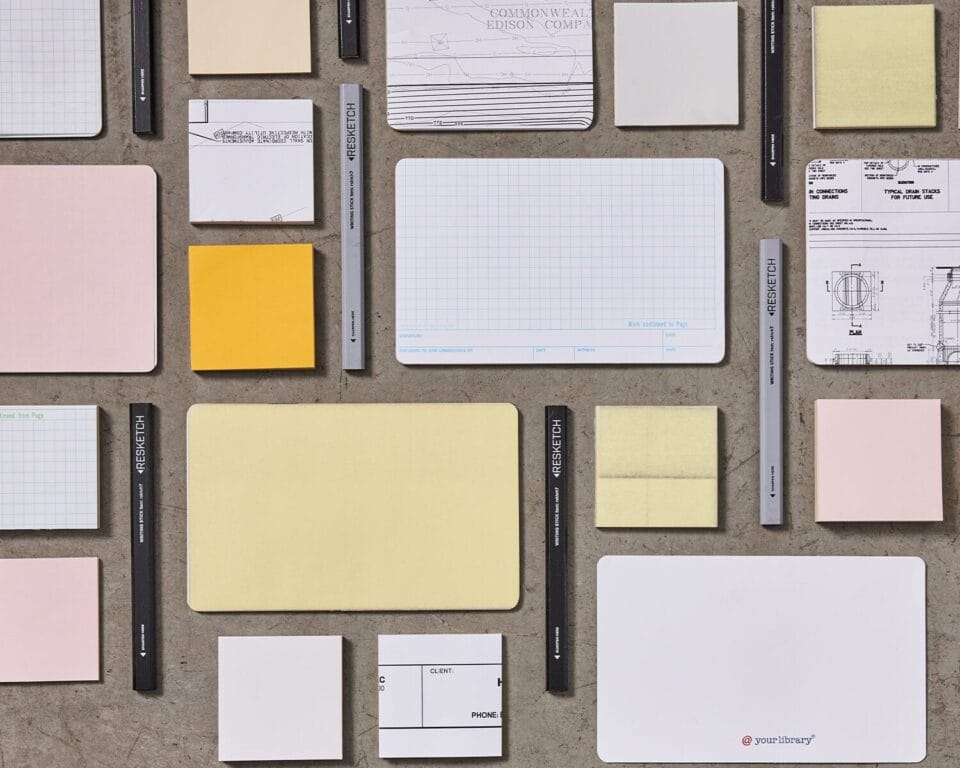 a collection of printed paper notepads