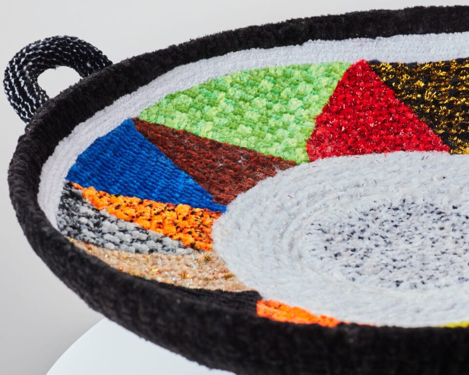 a vessel made from woven pipe cleaners with geometric pattern