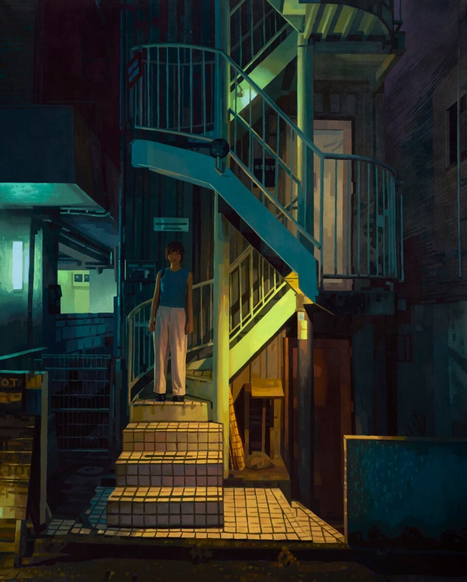 a woman on an illuminated stairwell
