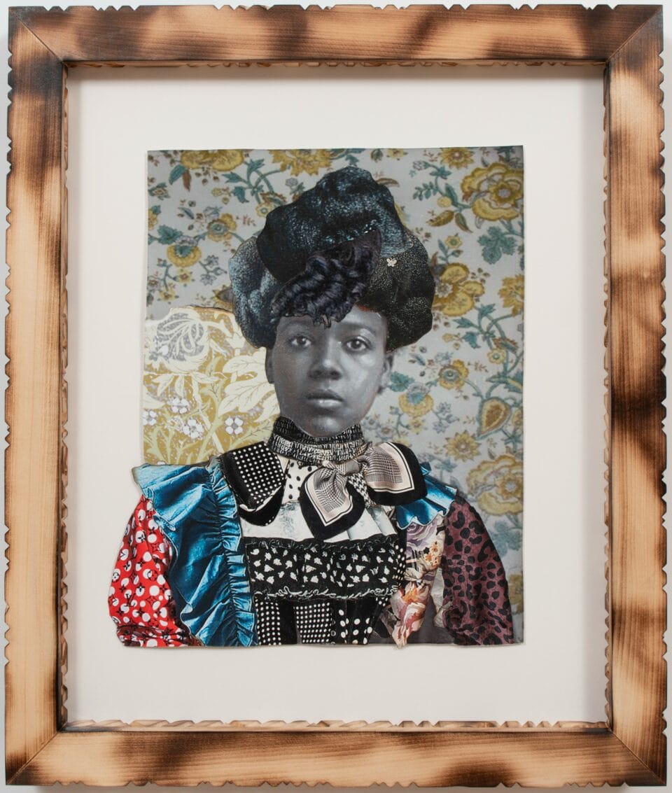 a collage of black and white photos and colorful textiles in a carved wooden frame. the photo depicts a woman