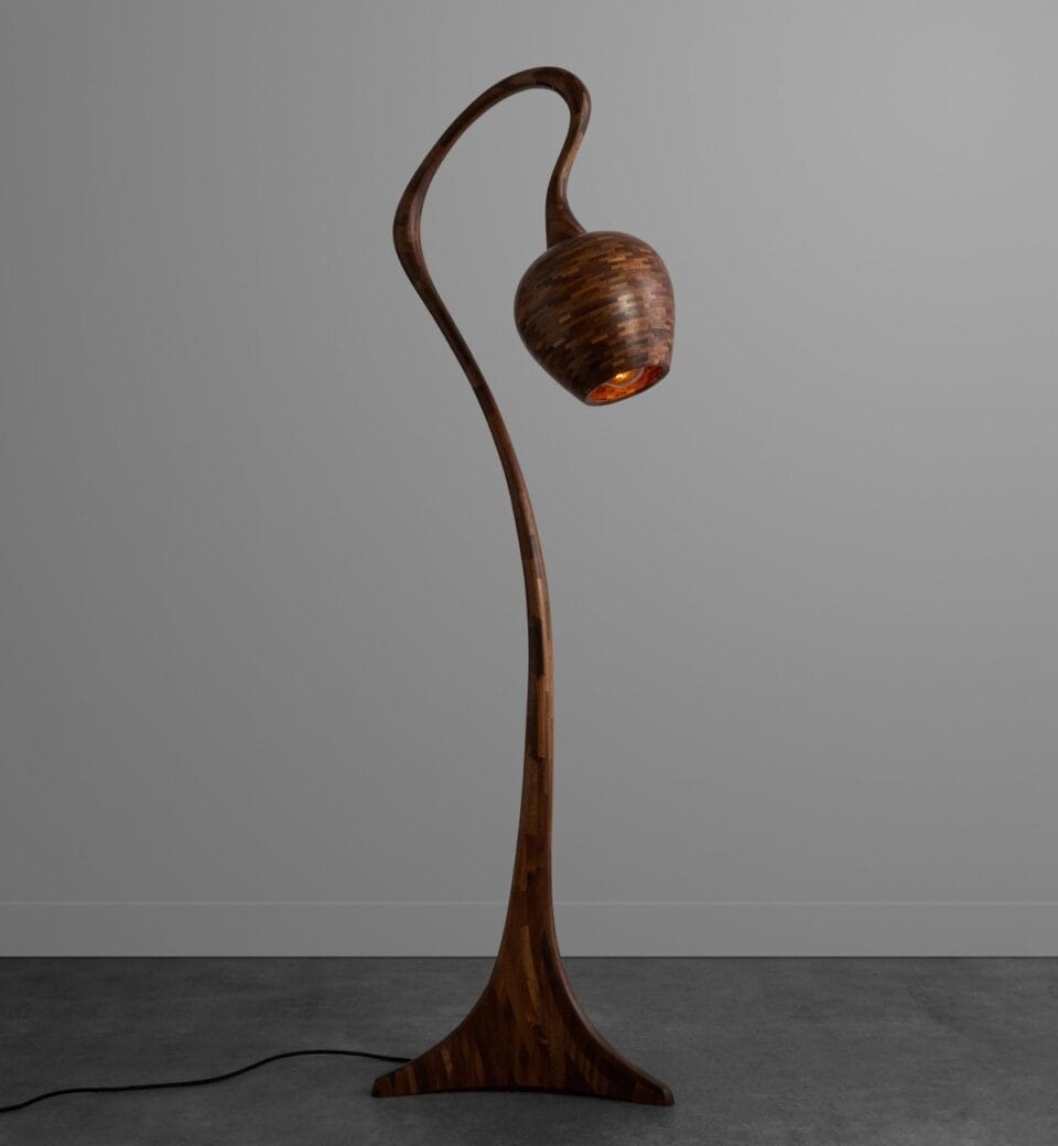 a wooden lamp made of small pieces of wood stacked together