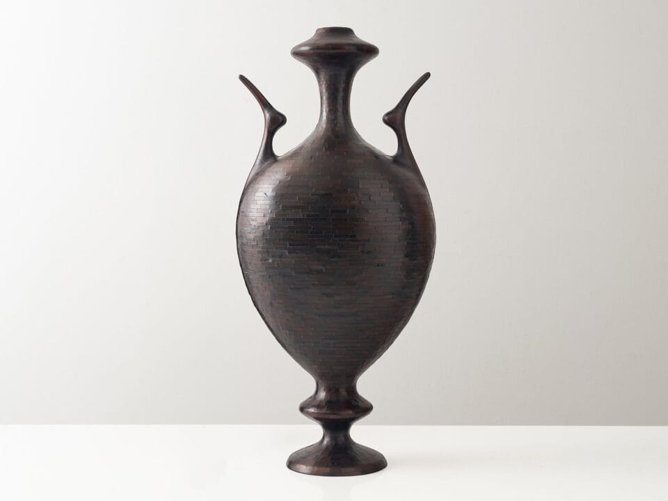 a wooden vessel made of small pieces of wood stacked together