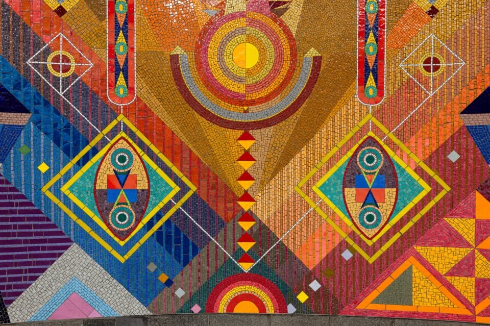 detail of a vibrant geometric mural made of mosaic