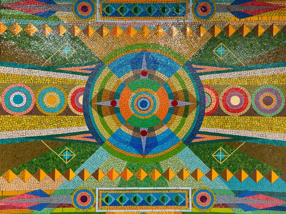 detail of a vibrant geometric mural made of mosaic