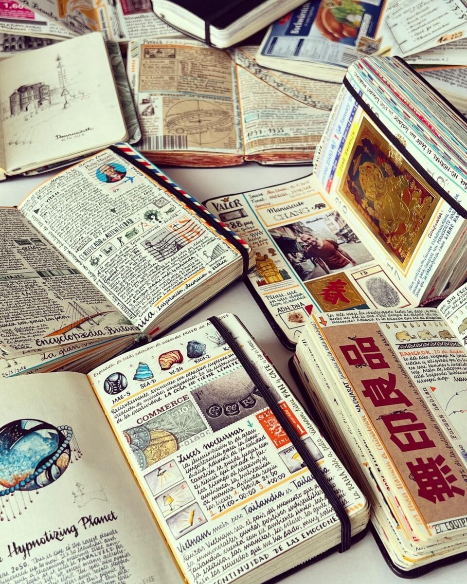 a series of small sketchbooks with elaborately designed travel notes and drawings