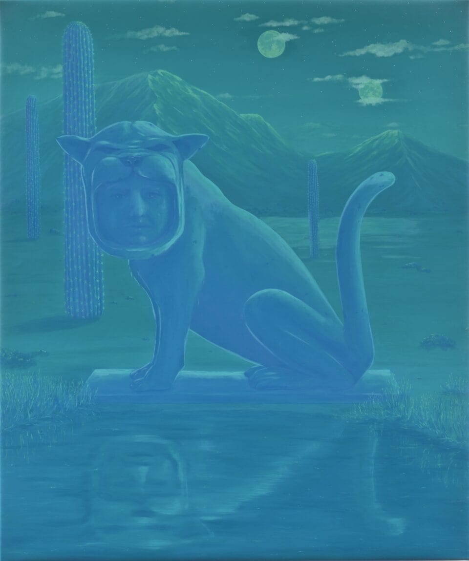 a cat sculpture with a human head in its mouth stands in a glowing green-blue desert landscape