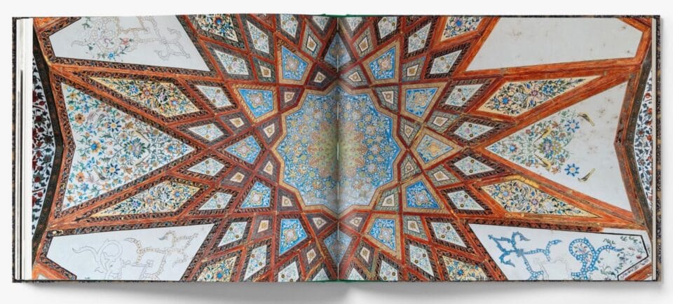 a spread from the book 'The Silk Road: A Living History' showing an elaborate, geometric mosaic